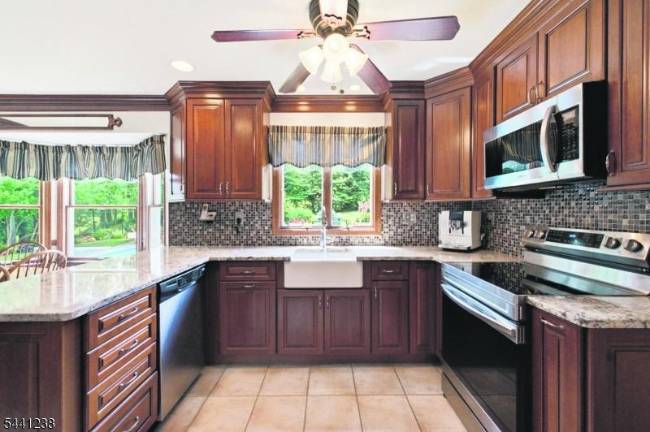 Sparta colonial features classic den, outdoor oasis