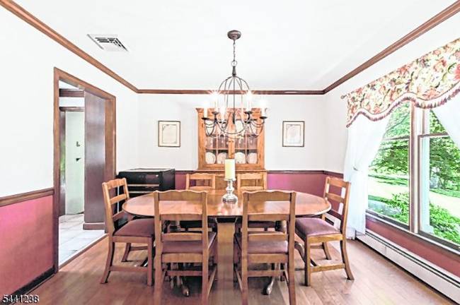 Sparta colonial features classic den, outdoor oasis