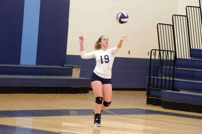 Sparta's Talia Smith in the midst of a serve. Photos by George Leroy Hunter