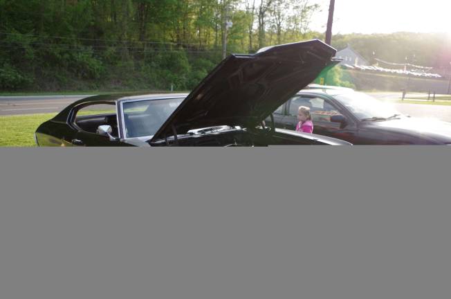 Youngsters check out a 1971 Chevy Chevelle.
