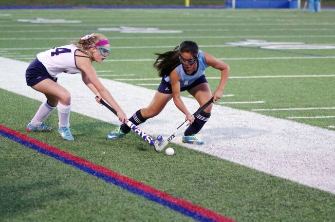 Jefferson's Lauryn Giordano and Sparta's Caroline Kepler behind the ball.