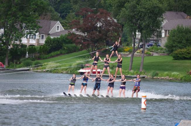 Several members of the Lake Mohawk Ski Hawks Water Ski Show Team form a pyramid on Lake Mohawk during practice on Saturday, July 15.