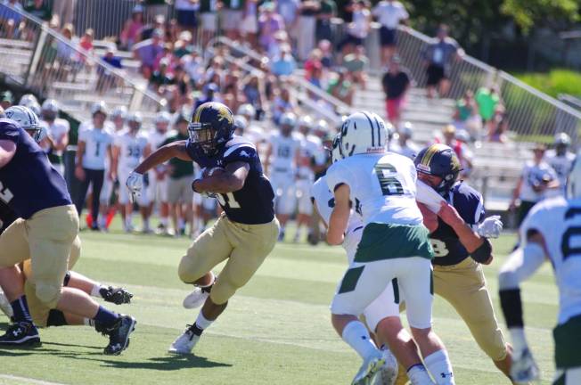 Pope John ball carrier Terrance Jones maneuvers the ball. Jones rushed for 142 yards and two touchdowns.