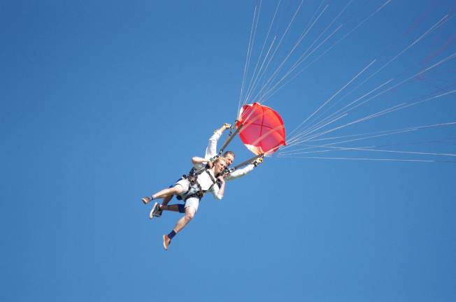 Eighteen year old Finnigan McGinley of Mendham, New Jersey strapped to his instructor comes back towards the earth. The jump was McGinley's first and he enjoyed it.