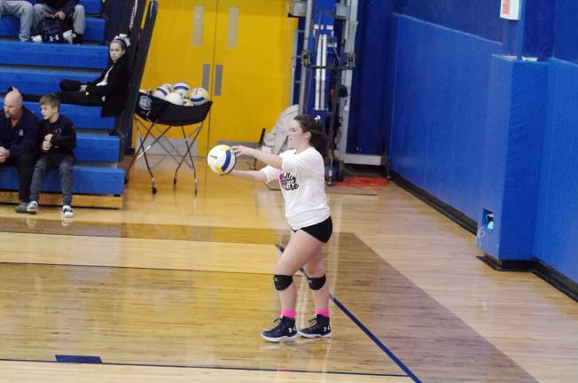 Pope John's Meaghan Lawrence about to serve.