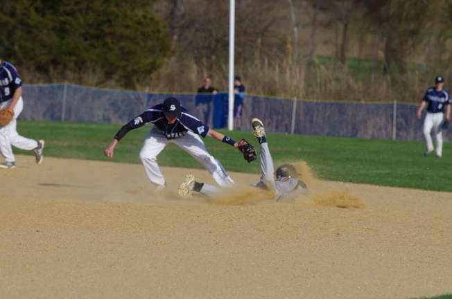 Austin Unglaub stretches to make the tag in 2015, while still a Sparta HS second baseman. Unglaub now roams the infield for Ramapo College Photo by George Leroy Hunter