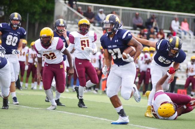 Pope John running back Terrance Jones on the move with the ball. Jones rushed for 86 yards and scored one touchdown.
