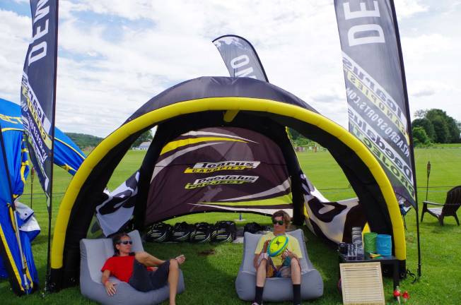 A couple of skydivers relaxing beneath an Icarus canopy. Started in 1999 ICARUS is one of the industry leaders in sport parachute design and innovation.