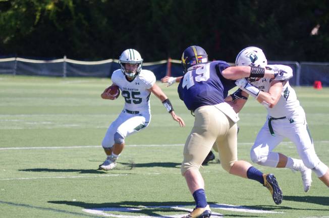 Delbarton ball carrier Anthony Siragusa attempts to avoid Pope John defenders.