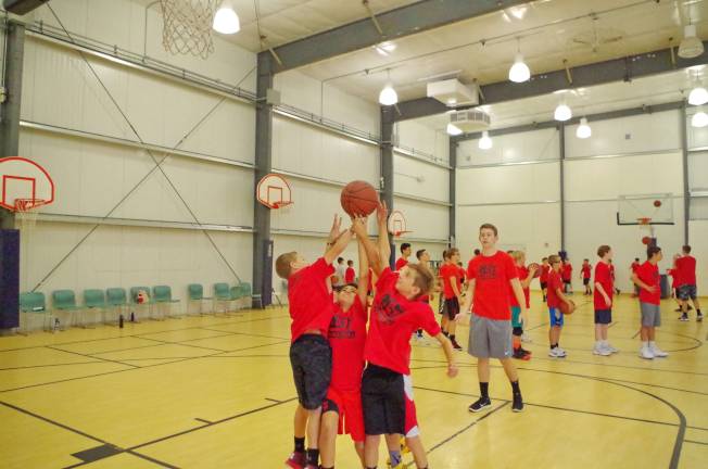 On Wednesday, July 19, basketball campers battle for control of the ball.