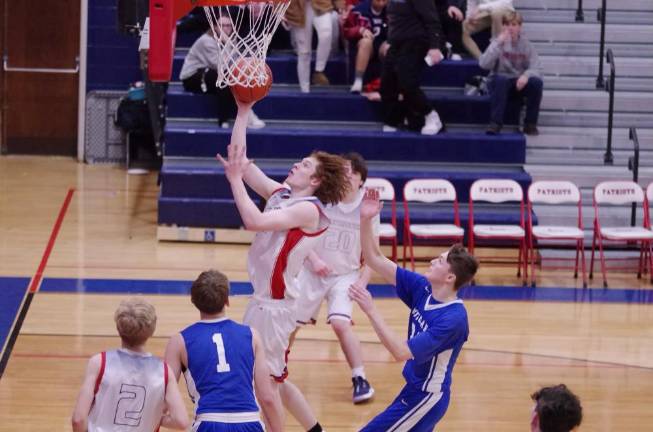 Lenape Valley's Troy Brennan soars toward the hoop during a shot in the fourth quarter.