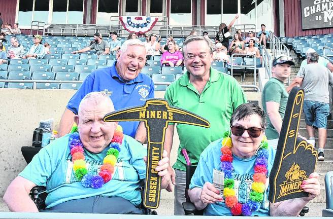 Knights of Columbus members and their families take in a Miners game.