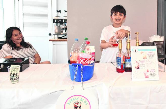 Lucas Jaffe of Sparta poses at the Bubbly Bliss table.