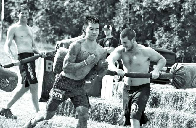 Photos by George Leroy Hunter Johnny Tieu of Brooklyn, NY, forces his way through a gauntlet of punishment. Tieu finished 17th overall.