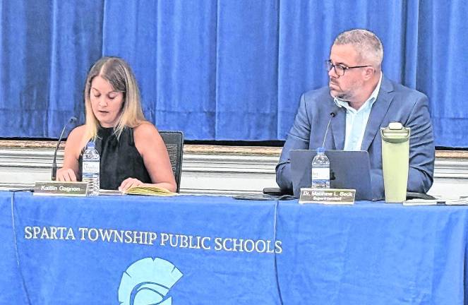 Sparta Public Schools Board of Education President Kaitlin Gagnon, left, speaks as Superintendent Matthew Beck looks on.