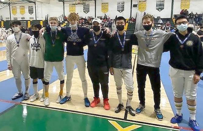 The top eight to advance to the final round of Men’s Saber: third from left, Neil Lilov (Morris Knolls High School, champion); fourth from left, Allen Trudnos (Pope John, fourth place); fifth from left, Konrad Czyrzewski (Newark Academy High School, third place); sixth from left, Deng Andrew (Newark Academy High School, second place) (Photo provided)