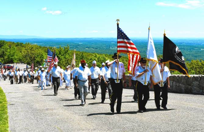 <b>Veterans march up to the New Jersey Veterans Memorial in High Point State Park on Sunday, June 29. (Photos by Maria Kovic)</b>
