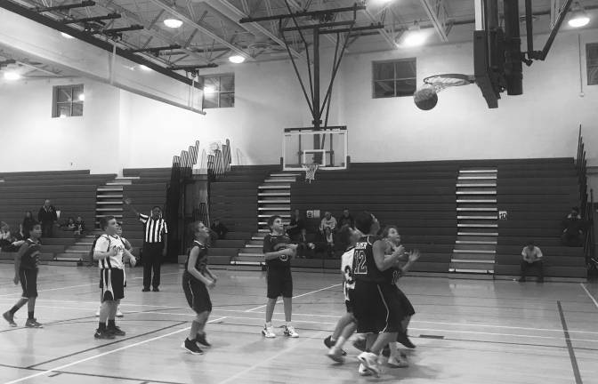 SWISH: Sparta PAL basketball player Henry Coleman scores, making it a tie score of 34-34, Sparta vs Hoptacong in the final quarter on Monday night at Sparta Middle School, before the Sparta team lost by two points. (Photo provided).
