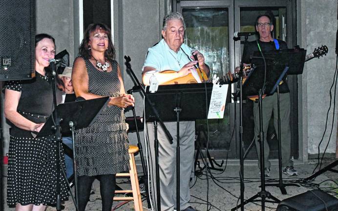 Bill McGowan performs ith other musicians.
