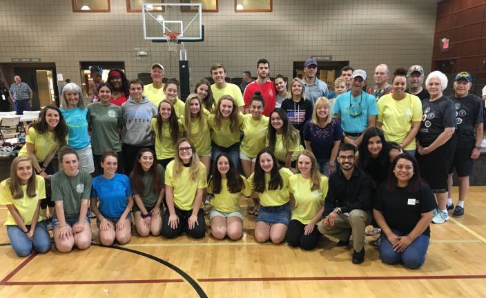 Members and volunteers of Pass It Along with veterans and outreach providers at Satiurday's Stand Down in Sparta Photos by Amy Shewchuk