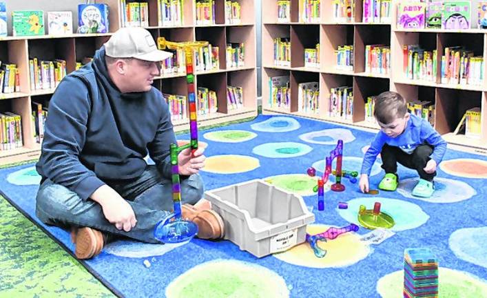 Steve and Will Marusiak of Sparta play.