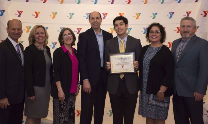 From left, (L-R): Metro YMCA President and CEO Richard K. Gorab, Sussex County YMCA Executive Director Jennifer Gardner, Sussex County YMCA School Age Child Care and Sports and Enrichment Director Samantha Walter, Brent Peterson, Evan Peterson, Diana Peterson, and Metro YMCA Senior VP/COO Ed Philipp