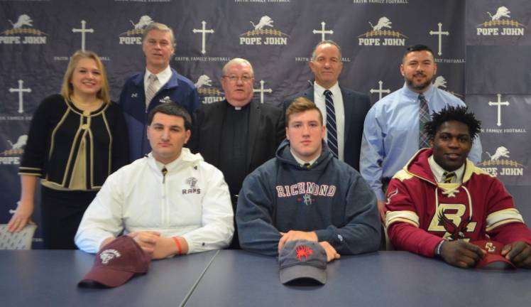 Pope John XXIII Regional High School senior football players Giovanni Potente, Louis Montana, and Ireland Burke signed letters of intent this week.