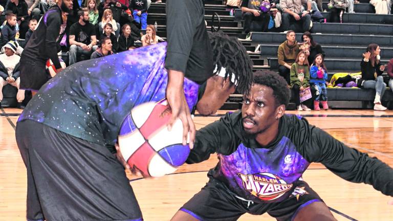 Harlem Wizards players perform.