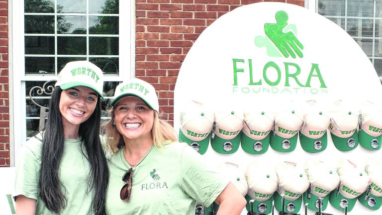 Flora Foundation founders Colleen Garone and Joanna Flora pose for a photo.