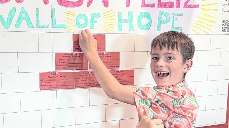 James Kierans updates the Wall of Hope.