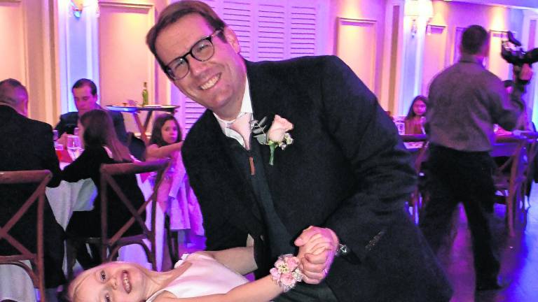 Ainsley Kane dances with her father, Charlie.