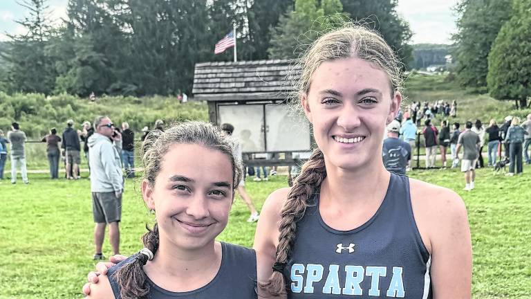 Sparta girls’ cross country captains Celia Rossettini and Sierra Harms