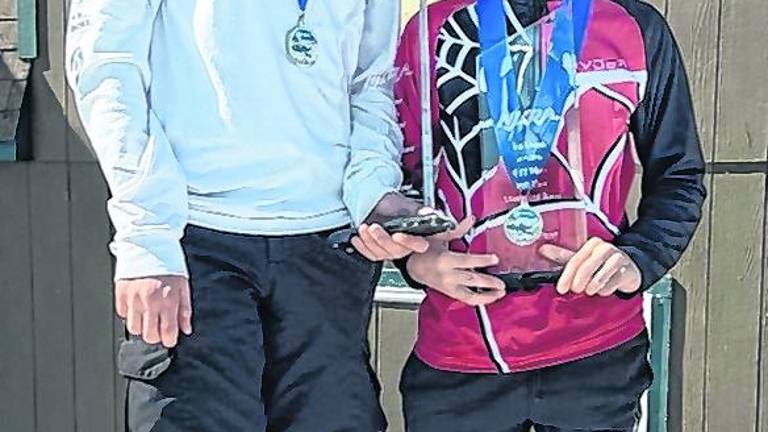 Patrick and Nicholas Brocky of Sparta are shown on the podium.