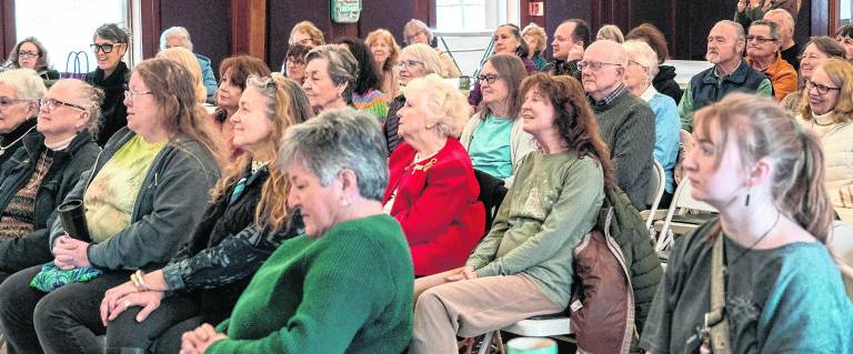 The audience enjoys the Martha Washington presentation
