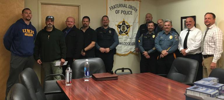 No Shave November at Sparta PD. From left, front row: Ptl. Thomas Herd, Sgt. Joseph Pensado, Cpl. Scot Elig, Sgt. Adam Carbery, Ptl, Taylor May, Sgt. Robert Fraser, Lt. John Lamon, DSG. Keith Hannam, Chief Neil Spidaletto, Back row: Sgt. Frank Schomp, Cpl. Dave Pridham. Not pictured and also contributing to the No Shave donations were, Cpl. Mark Mastandrea, Cpl. Joseph Antonello, Cpl. Rick Smith, Ptl. Dan Elig, Ptl, Thomas Snyder, Ptl. Timothy Lynott, Ptl. Chris Favaro, Ptl. Eric Finley, Ptl. Steve Guido. Also contributing were Animal Control Officer Don Critchlaw, S.O. Phil Coleman, Gail and Alan Fraser, Janice Illingworth, Debra Carbery, and Charles and Barbara Collver.
