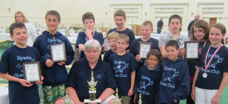 Kids from left, Keith Johnson, Anthony Esposito, Griffin Mendel, Lucas Rendina, Thomas Wolfe, Reilley Kasabri, Christopher Hakkenberg, Vaiden Pollard, Sam Esposito, Travis Kasabri, Morgan Kasabri, Elizabeth Wolfe. Center is Coach Tom Murray.