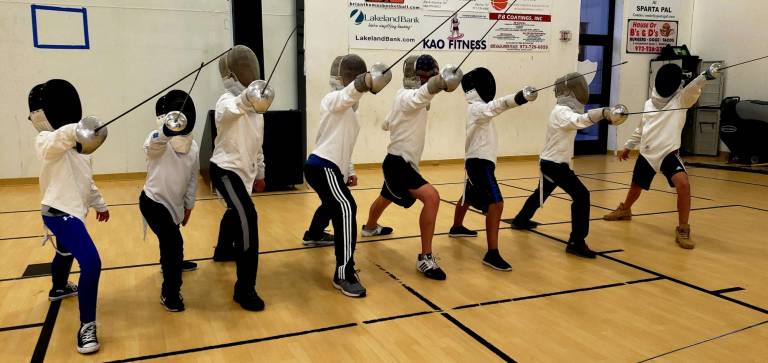 En garde! Young fencers at the PAL building in Sparta, where they learn their skills.