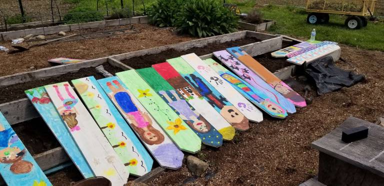 Handpainted by volunteers at Ginnie's House, these colorful fence panels are part of the new Children's Educational Garden at Sunset View Farm in Andover.