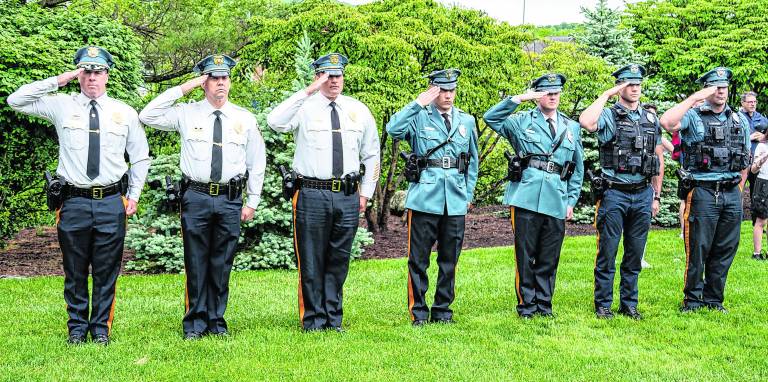 The Sparta police salute during the ceremony.