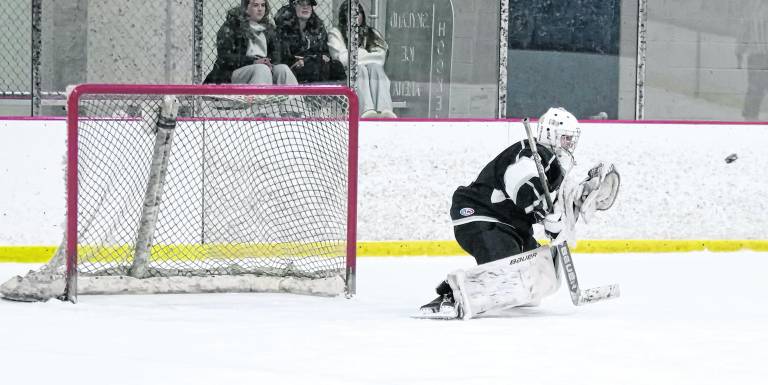 K.J.S. United's goalie Stefan Filewicz drops down to intercept the incoming puck. Filewicz made 27 saves.