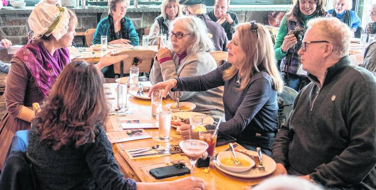 Attendees talk to Vivian Davis.