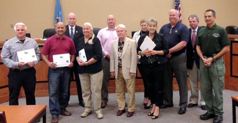 Photos by Amy Bate Graduates from the CERT program, from left, Councilman Gil Gibbs, Councilman Joshua Hertzberg, Councilwoman Molly Whilesmith, Township Manager William Close; Front, from left, CERT Graduates John Vesper, Kevin Lynch, Helen Predmore, MayorJerry Murphy, Deputy Mayor Christine Quinn, Chief of Police Ernie Reigsted, CERT Coordinator Alex Kloian.