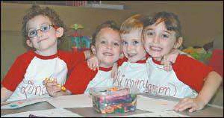 First day of school  times four for this Vernon family - Quadruplets, now 5, head off to kindergarten