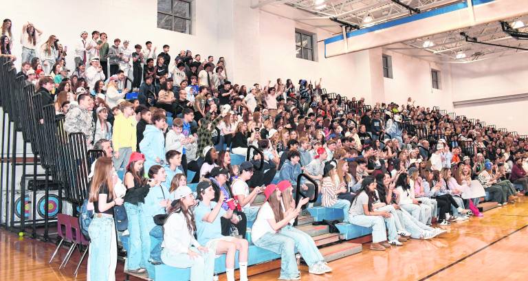 The community filled the bleachers to watch.