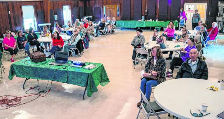 The audience watches the show, which is part of the historical society’s series of Women’s History Month events.