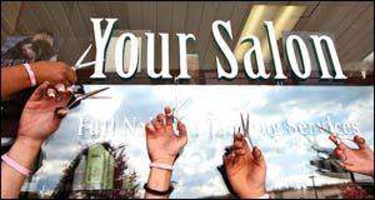 Byram Salon holding Cut for a Cure