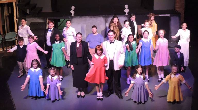 The cast of Annie Jr. with Sadie Donnelly as Annie.