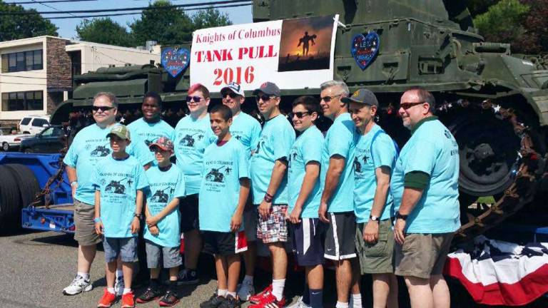 Members of the state Squires team “Esto Dignus” stand in front of the tank prior to the competition.