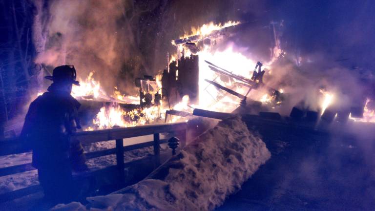 submitted photos Firefighters fight an early Tuesday morning blaze that engulfed the home at 7 Rocky Terrace. No injuries were reported but the homes was completely destroyed. As of 11:15 a.m., the fire was still burning. Multiple local fire departments remain on scene.