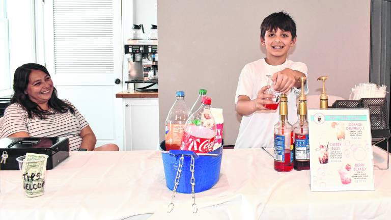 Lucas Jaffe of Sparta poses at the Bubbly Bliss table.